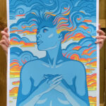 Screen print of a blue-skinned figure with hands crossed over breasts and long hair flowing out against the background of a sunrise