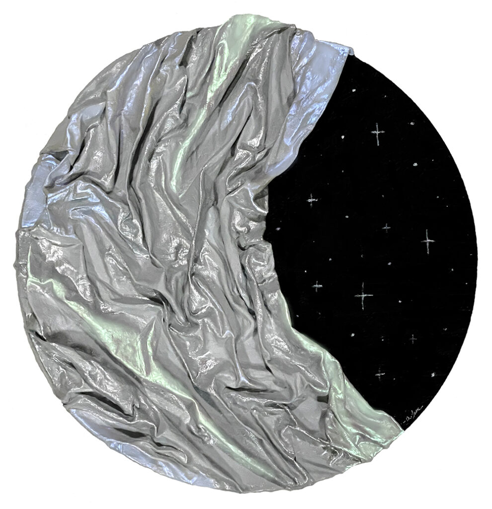 Art piece: black circular form painted with stars, half wrapped in silver fabric resembling a moon.